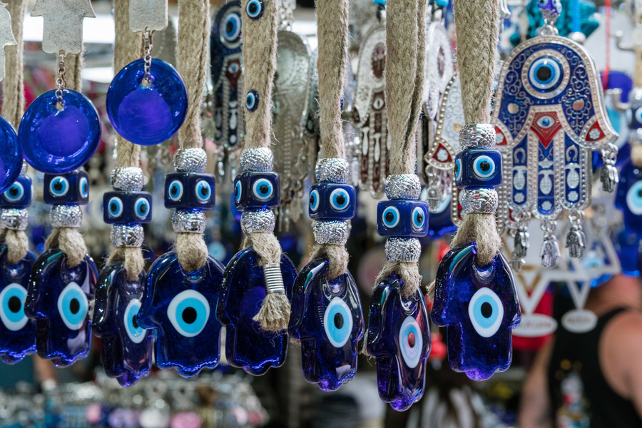 Charms to ward off the evil eye (hamsas) in Carmel Market, Tel Aviv