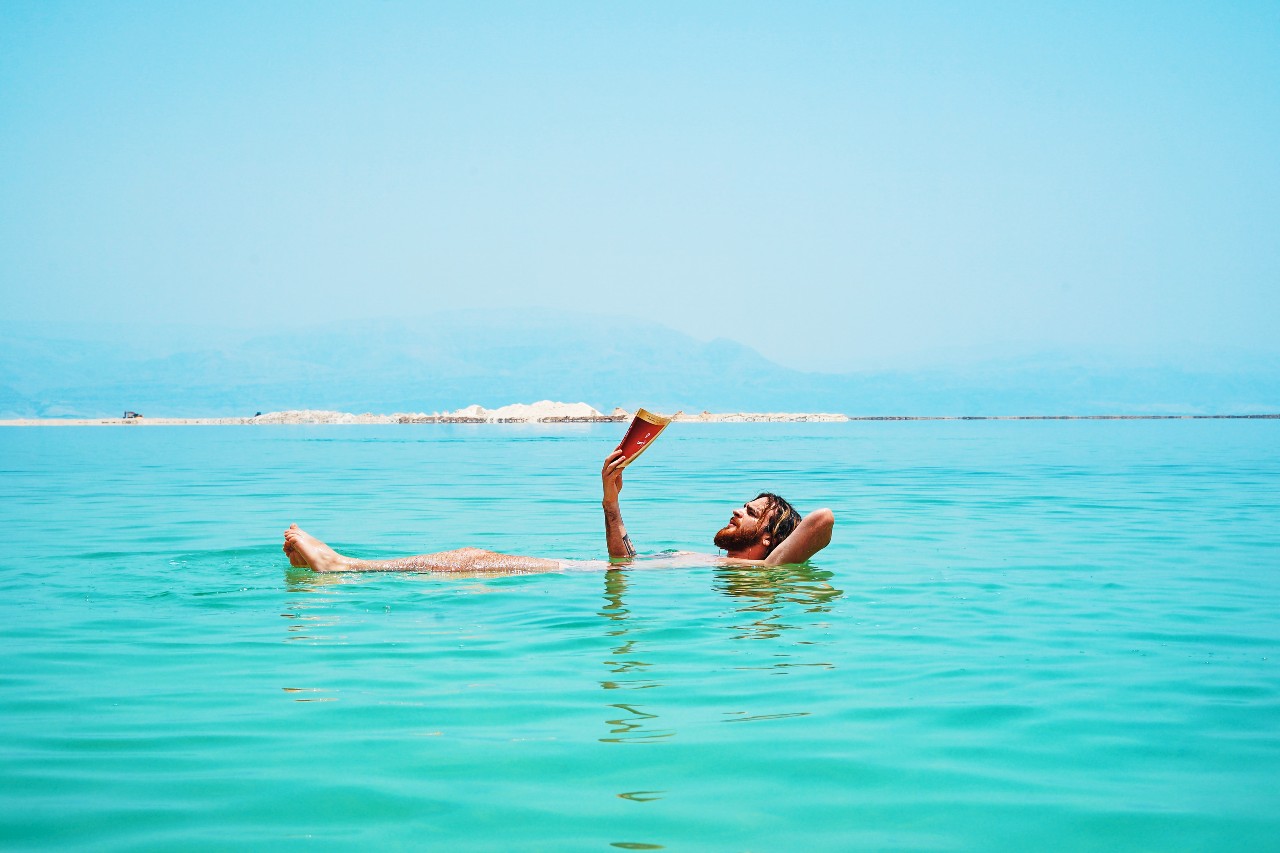 Floating while reading a book at the Dead Sea
