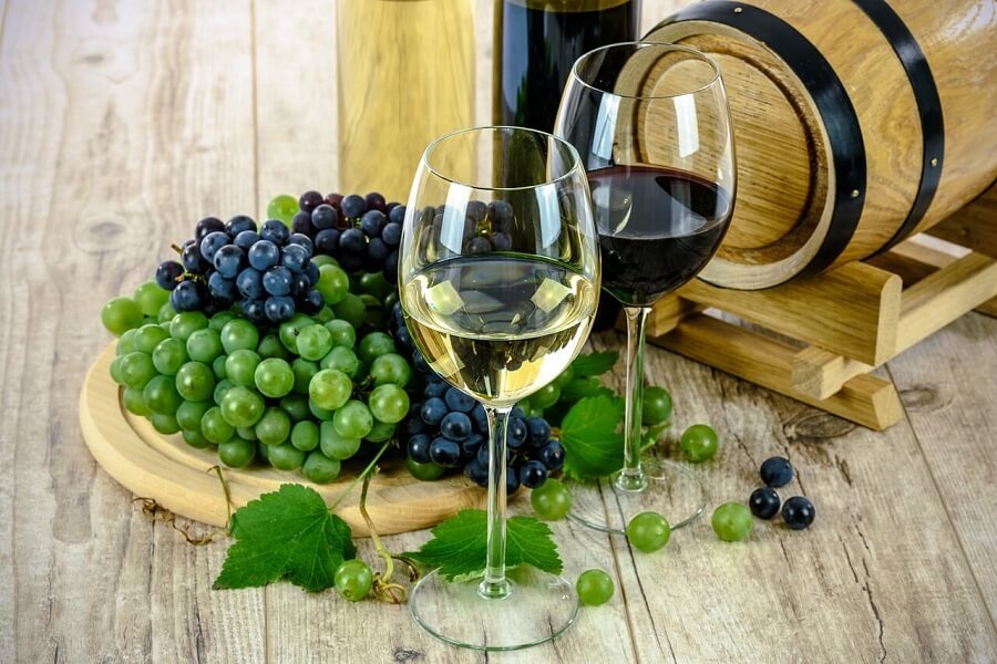 Grapes and a glass of white wine