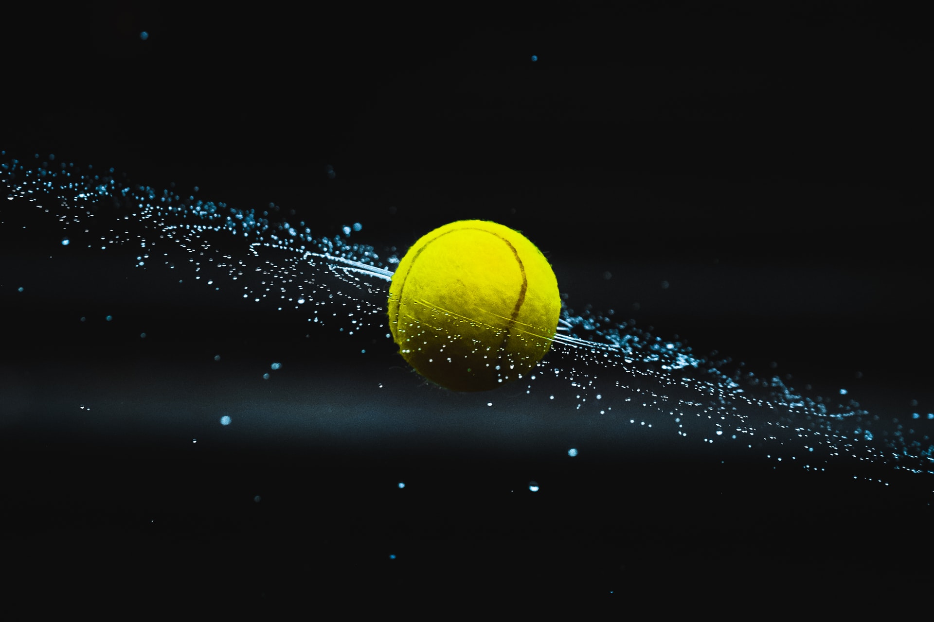 Green and yellow tennis ball on water