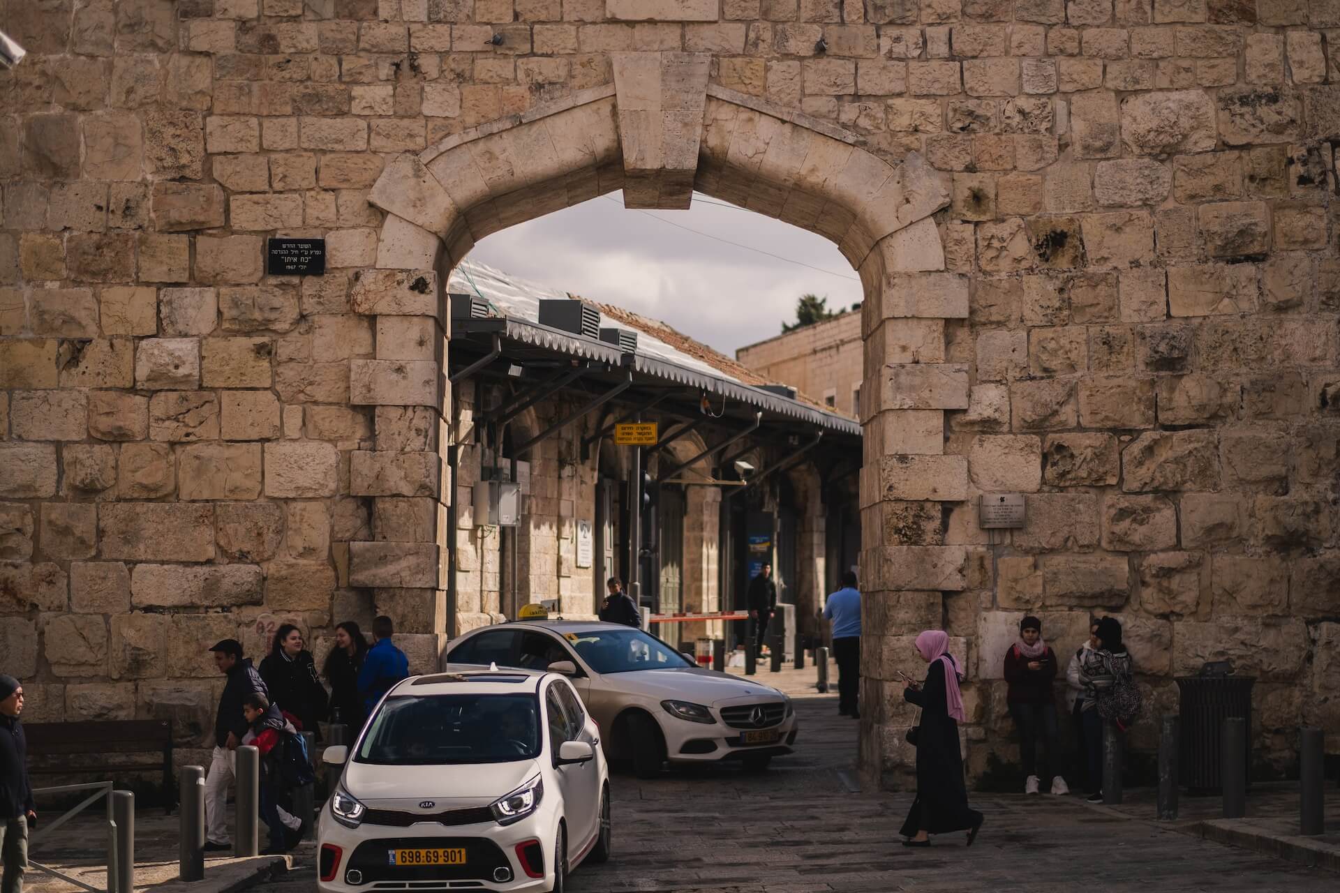 Travelling in Israel- An Israeli Taxi stands at a gate in Jerusalem