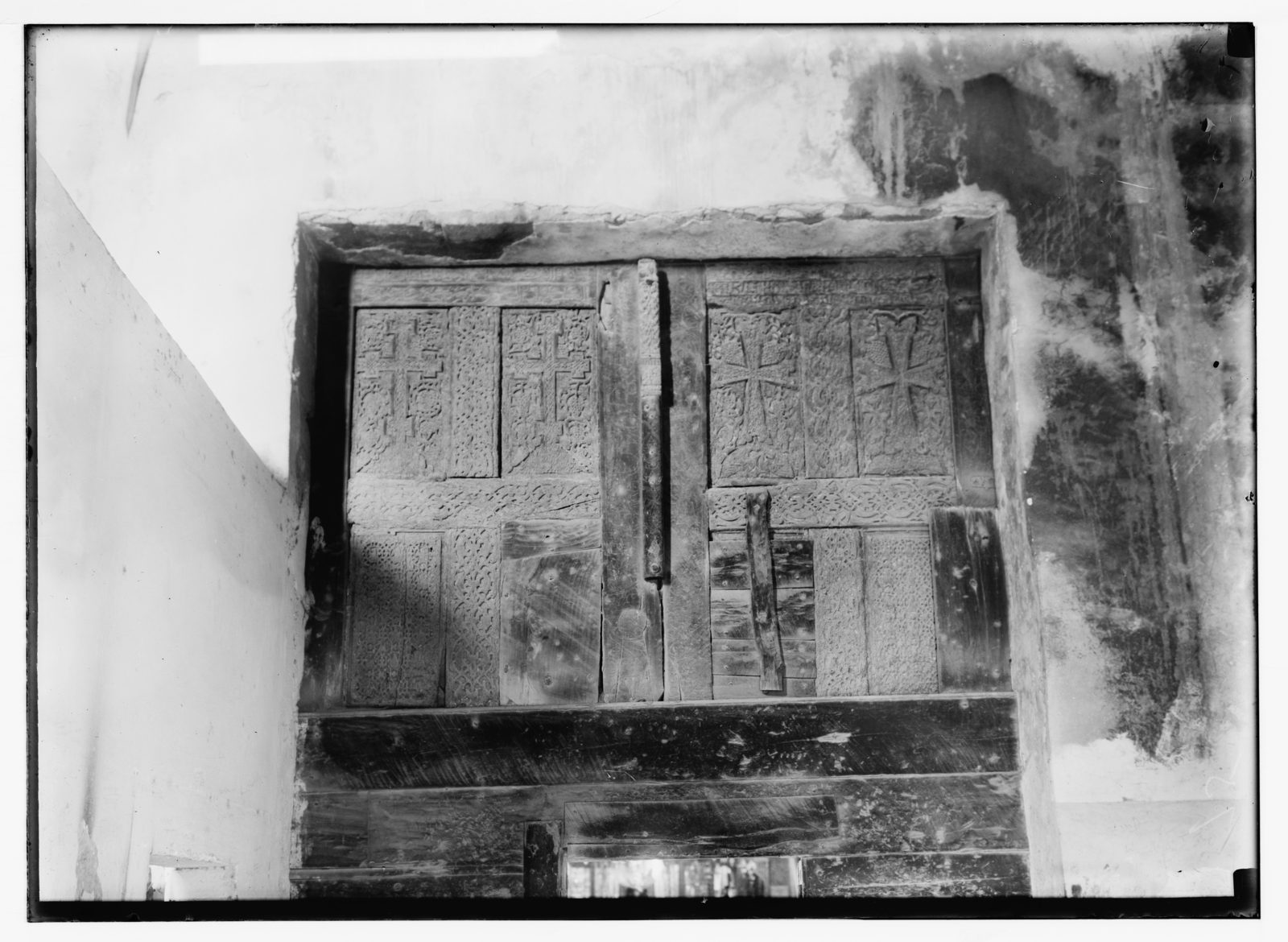 Carved wooden door details at Bethlehem’s Church of the Nativity, photographed in 1900. This historical image illustrates woodcarving; the source does not identify the wood species. Carved wooden door details at Bethlehem’s Church of the Nativity, photographed in 1900. This historical image illustrates woodcarving; the source does not identify the wood species.