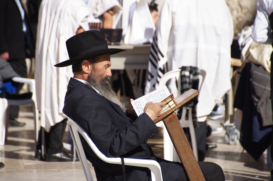 A reading Jewish man at the Wailing Wall, Jerusalem