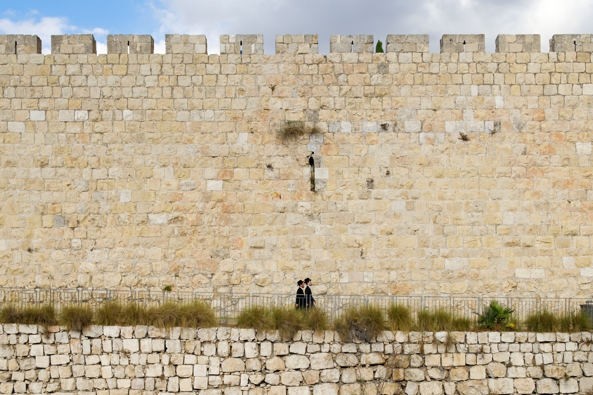 Religious Jews against the background of Jerusalem walls