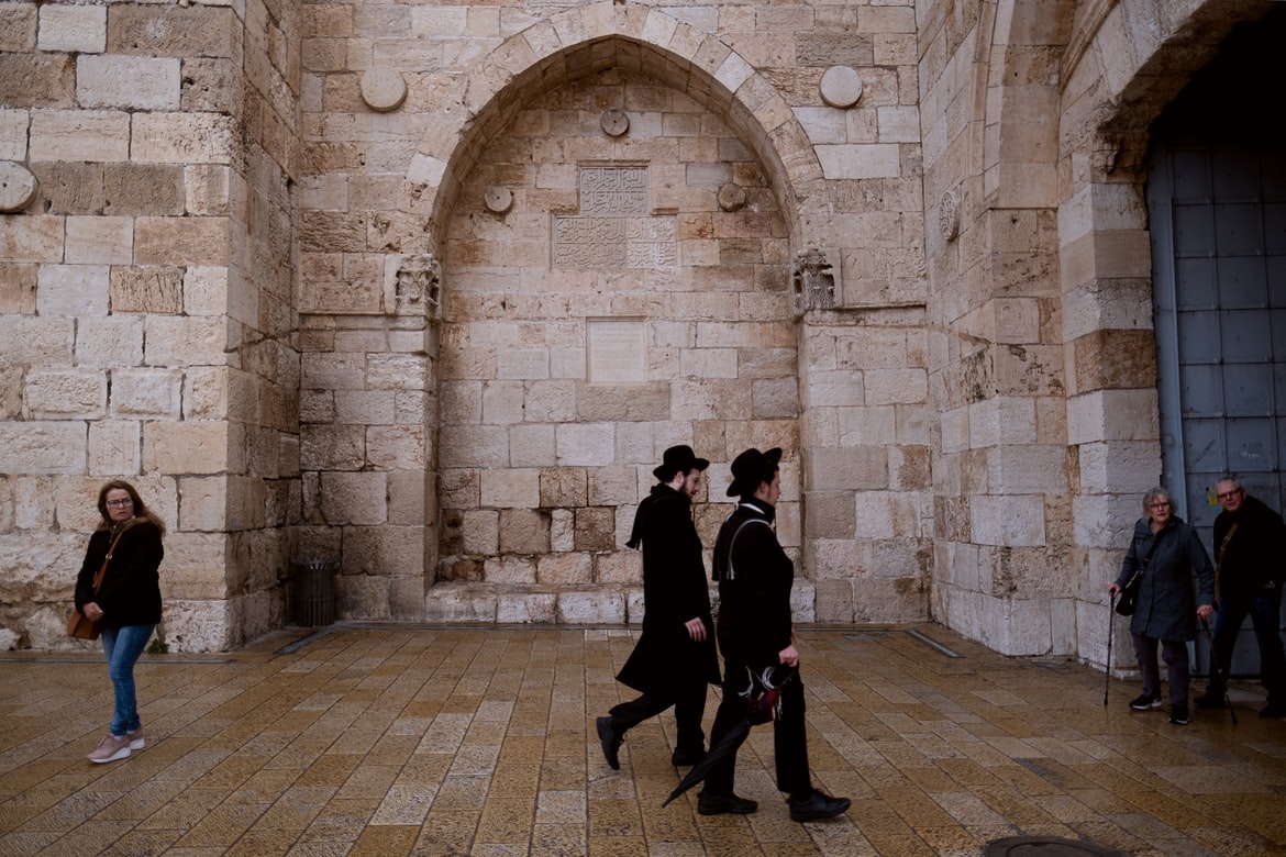 Haredim walk toward the Jaffa Gate into the Old City of Jerusalem