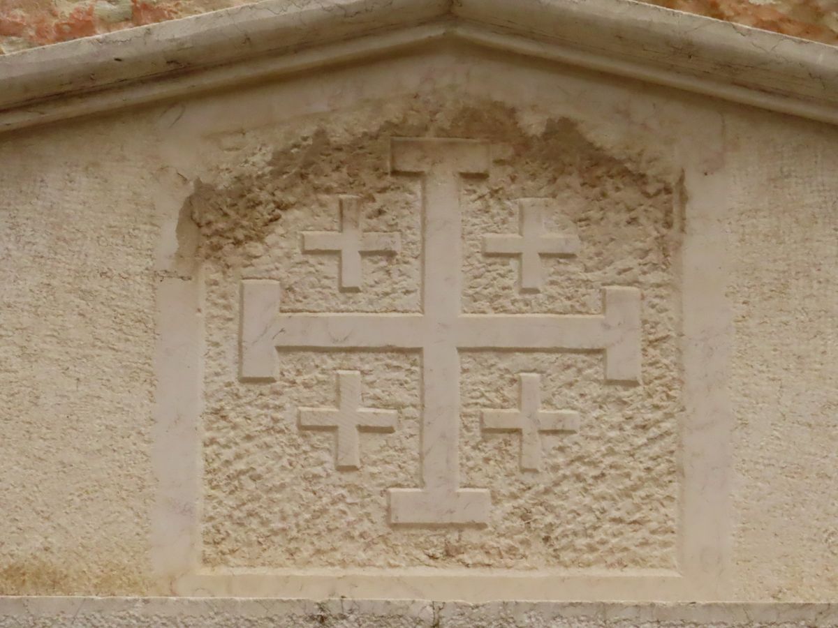A Jerusalem Cross carved into stone on St. Francis Street in Jerusalem’s Christian Quarter.