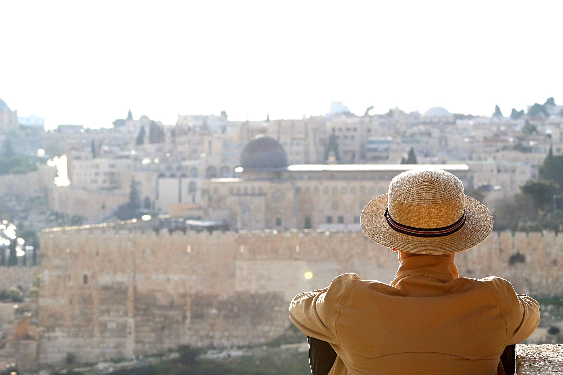 A tourist on the observation deck in Jerusalem looks at the Al-Aqsa Mosque