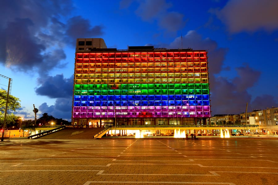 Rainbow flag lighting over Tel Aviv city hall building for Tel Aviv Pride