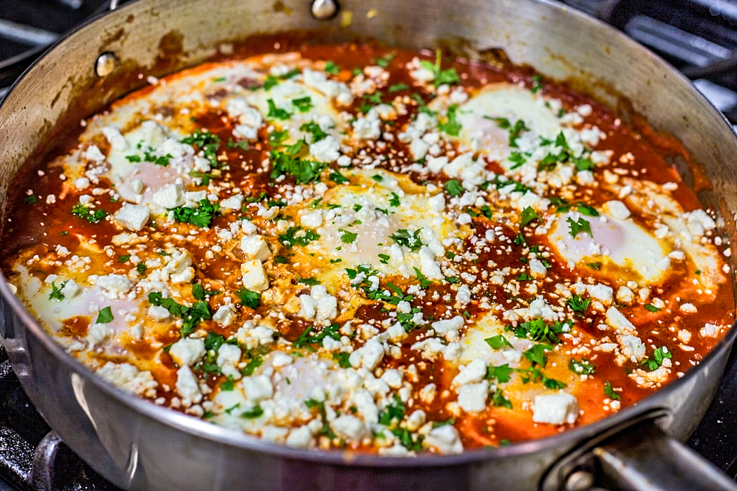 Shakshuka. Eggs Poached in Tomato Sauce