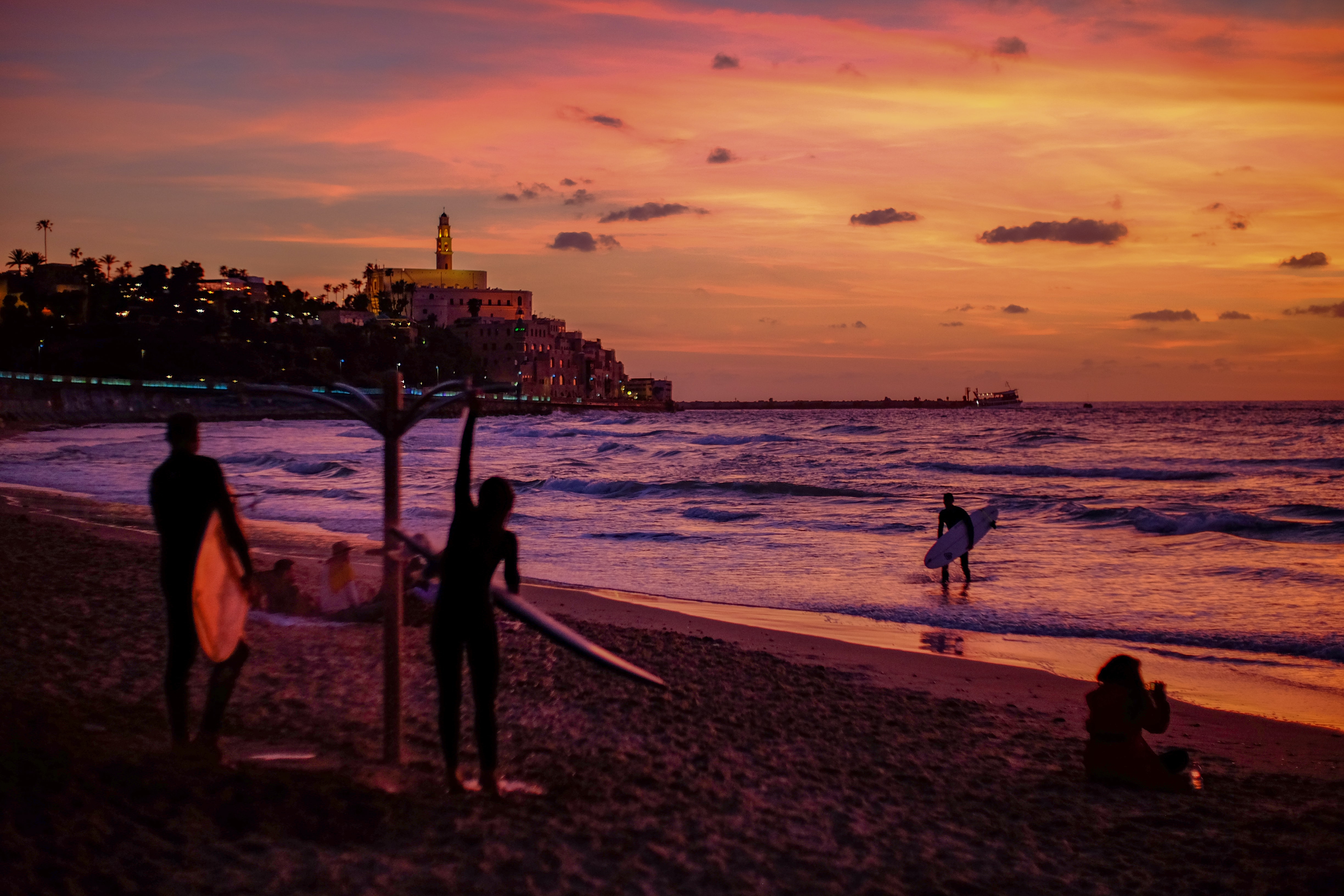 Surfers at Alma Beach in Tel Aviv