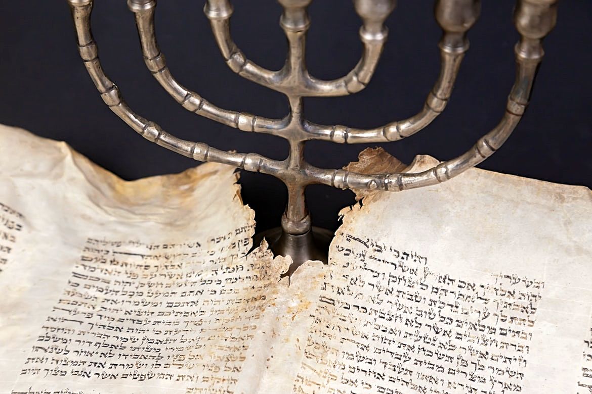 Old scrolls of the Jewish Bible and Menorah